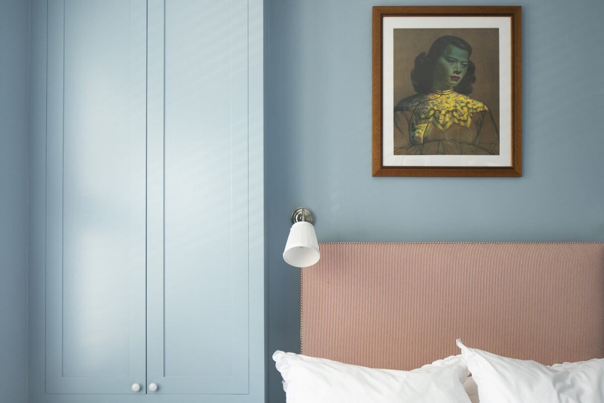 Muted Natural Colors in a Victorian House 15 blue-bedroom-pink-headboard-built-in-wardrobes-nordroom