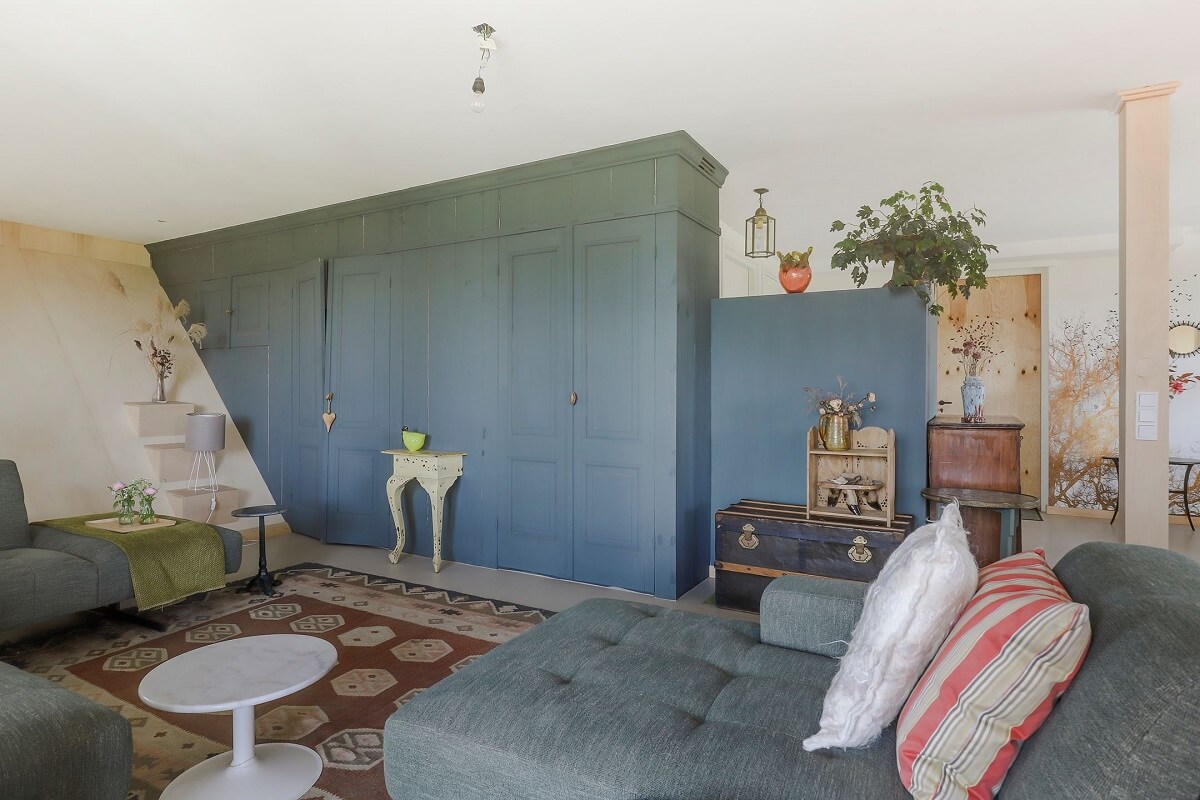 A Unique Upside Down House in The Netherlands 4 blue-custom-made-cabinet-upside-down-house-slanted-wall-nordroom