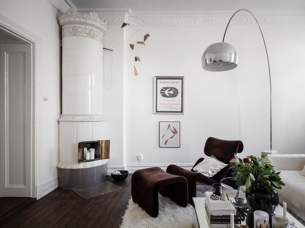 A Scandi Home with Stainless Steel Kitchen and Wallpaper 19 brown-lounge-chair-living-room-fireplace-nordroom