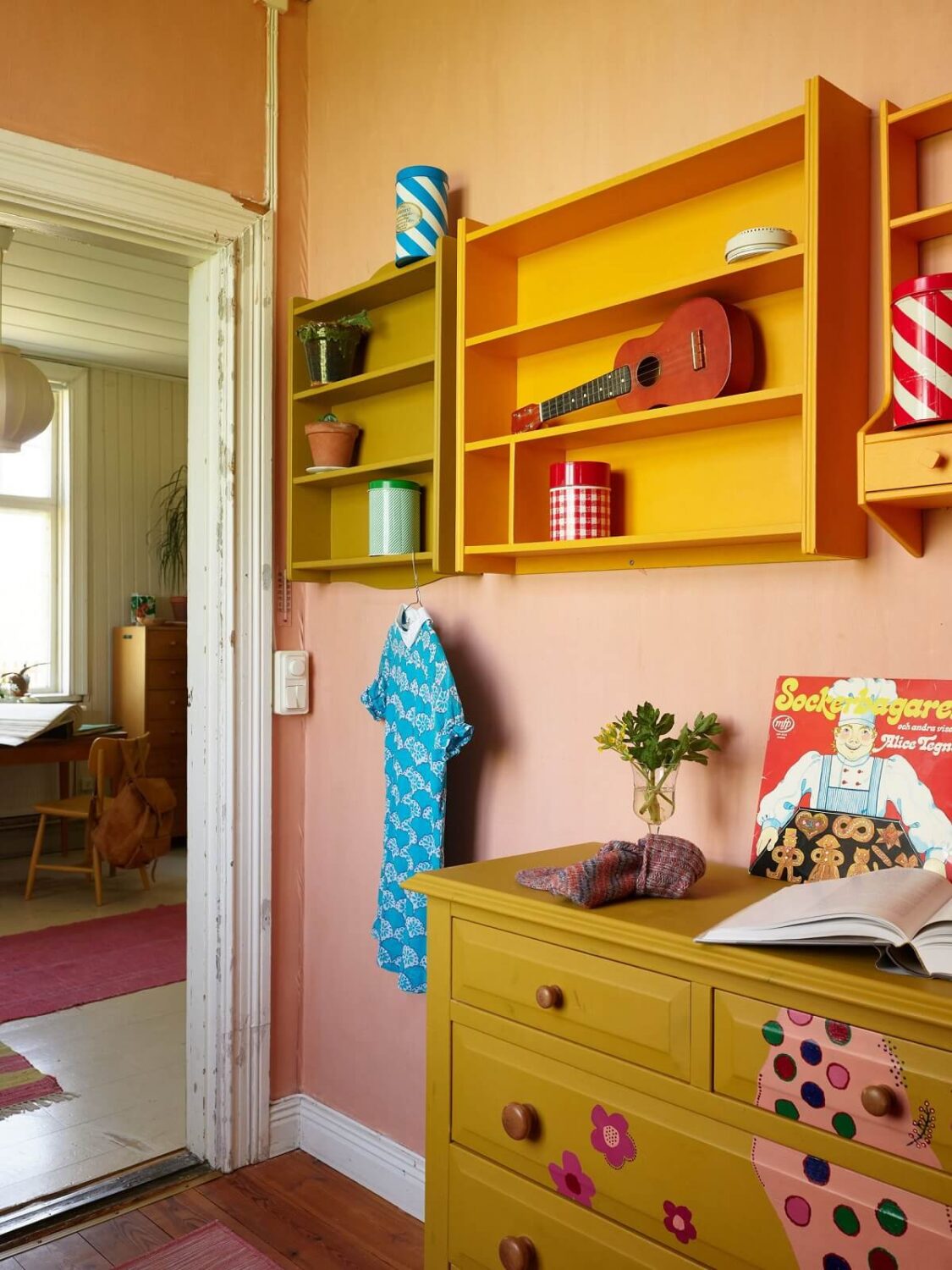 A Vintage Colorful Family Home in the Swedish Countryside 20 colorful-kids-room-pink-walls-yellow-dresser-nordroom