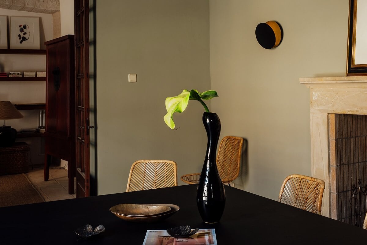 A Renovated Historic Townhouse on Mallorca 11 dining-room-black-table-fireplace-nordroom