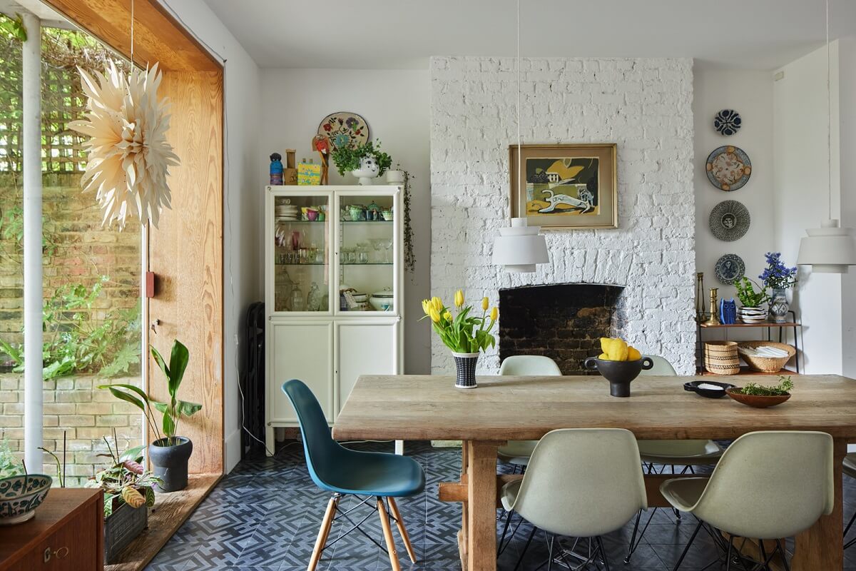A Light Victorian Townhouse with Teal Reading Room 9 dining-room-eames-chairs-large-window-garden-nordroom