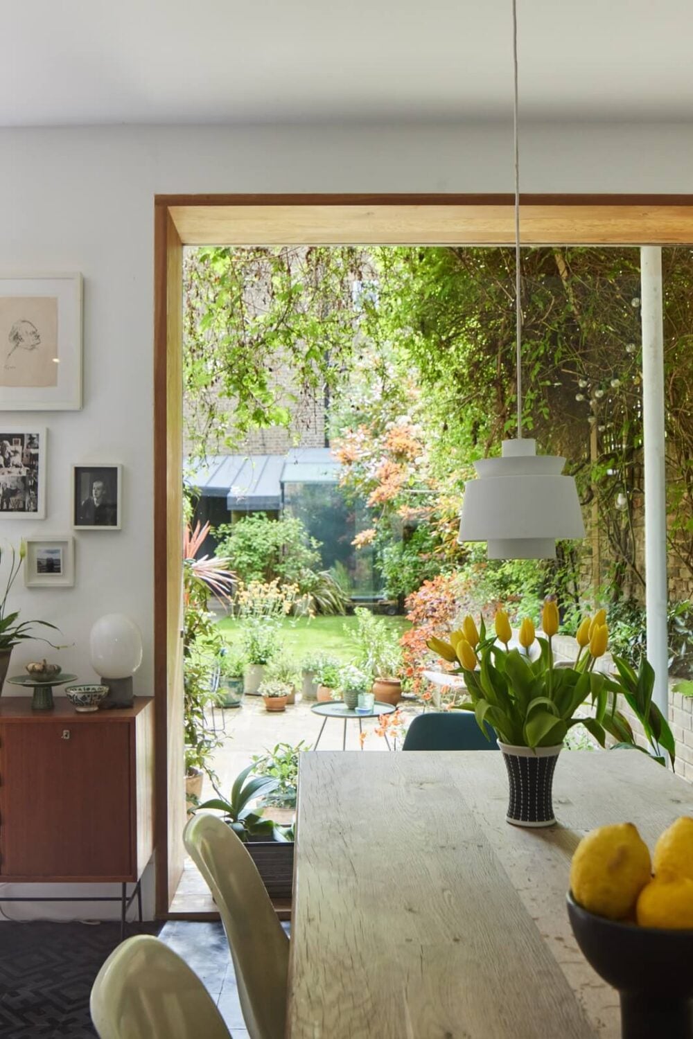 A Light Victorian Townhouse with Teal Reading Room 10 dining-room-large-window-overlooking-garden-nordroom