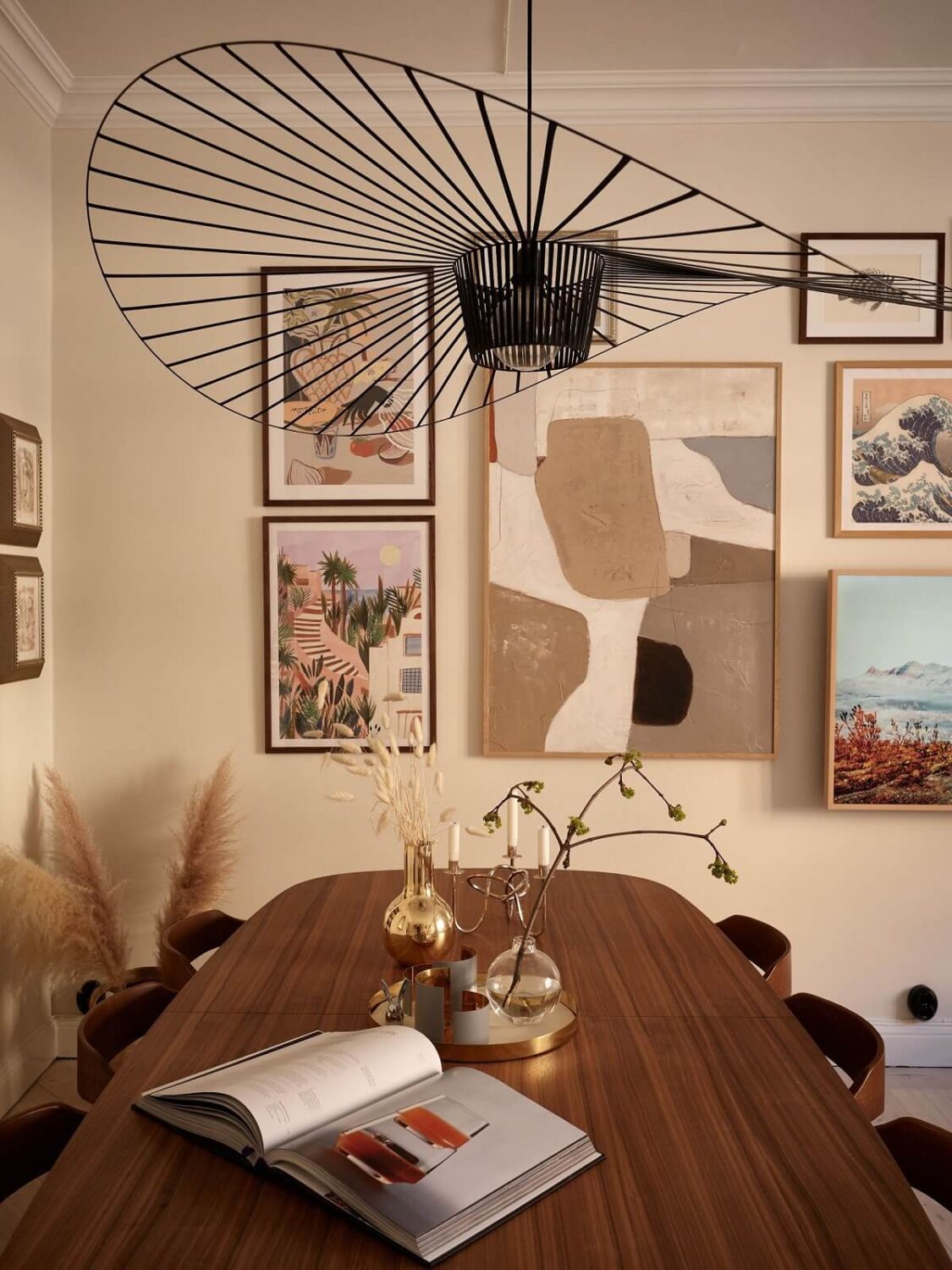 Warm Muted Colors in a Stockholm Apartment 5 dining-table-rounded-corners-beige-walls-gallery-wall-nordroom