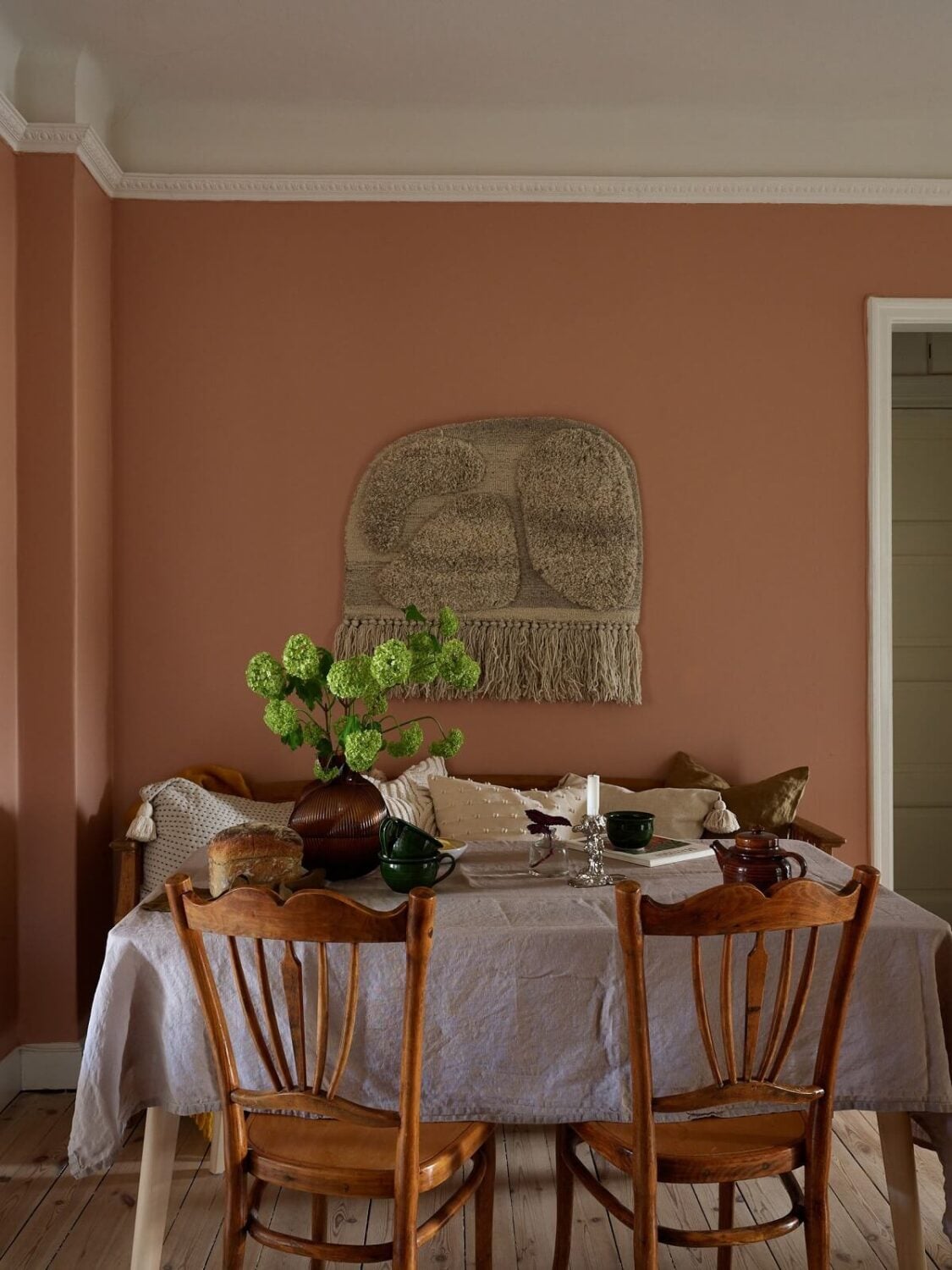 A Scandinavian Apartment with a Light Green Bedroom 8 dusty-pink-walls-dining-room-scandinavian-apartment-nordroom