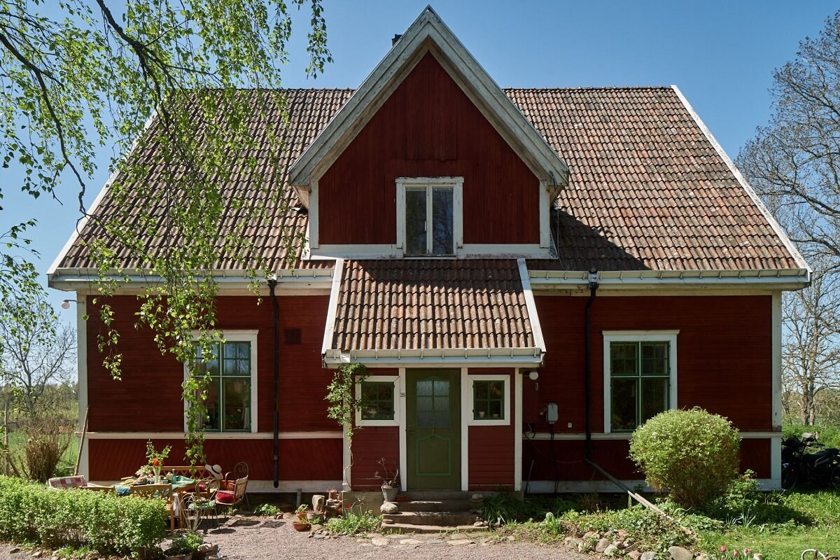 A Vintage Colorful Family Home in the Swedish Countryside 1 exterior-red-wooden-swedish-house-nordroom
