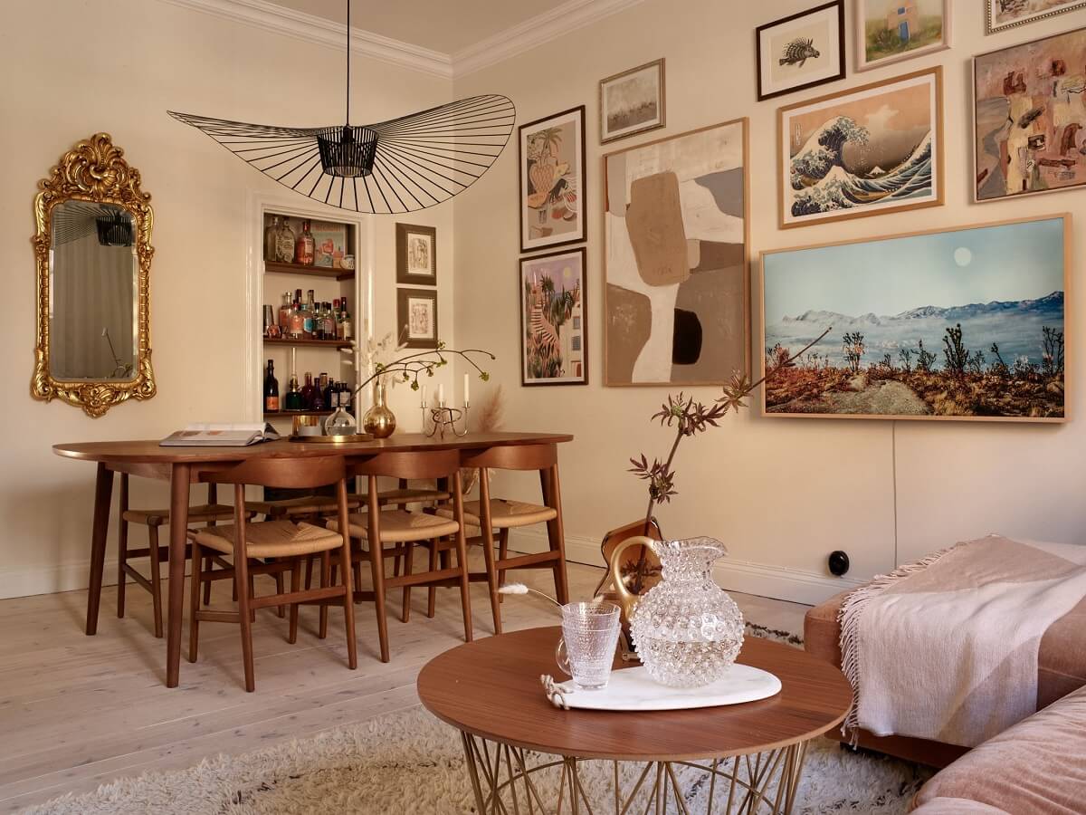 Warm Muted Colors in a Stockholm Apartment 1 gallery-wall-beige-paint-walls-warm-living-room-dining-table-nordroom