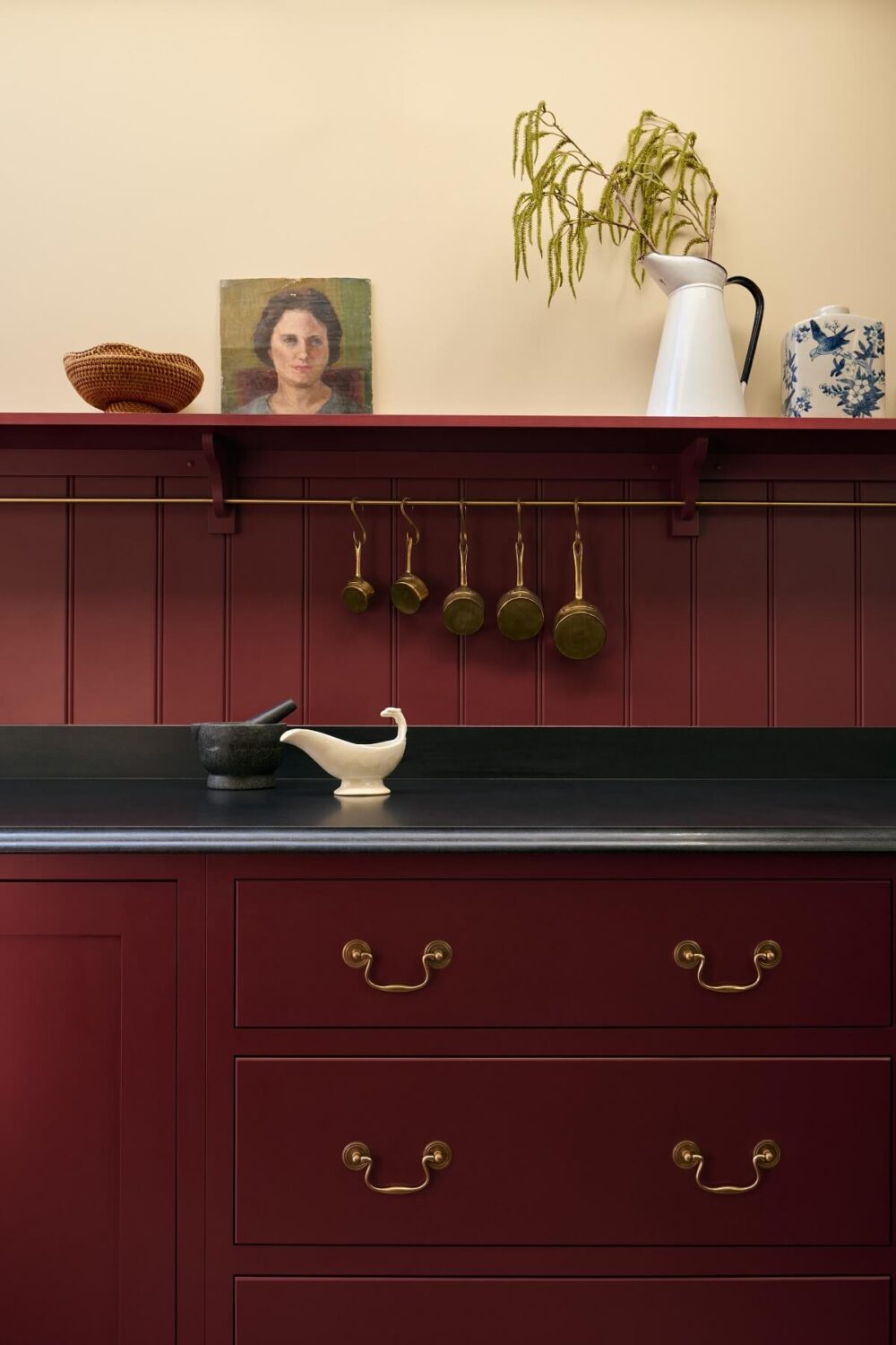 A Warm Refectory Red deVOL Kitchen 7 granite-worktop-deep-red-shaker-cabinets-tongue-and-groove-backsplash-shelf-with-hanging-rack-nordroom