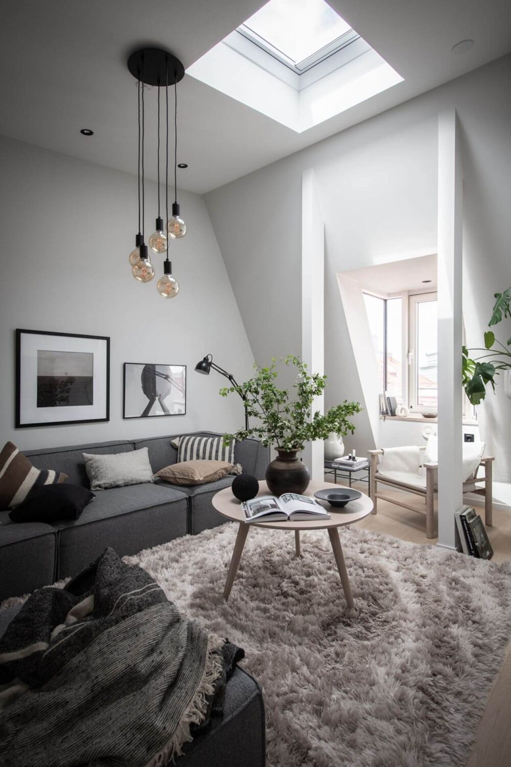 A Stylish Scandinavian Attic Apartment 3 gray-white-scandinavian-living-room-dormer-window-skylight-attic-apartment-nordroom