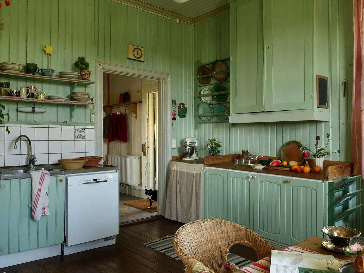 A Vintage Colorful Family Home in the Swedish Countryside 14 green-vintage-kitchen-shelves-sweden-nordroom