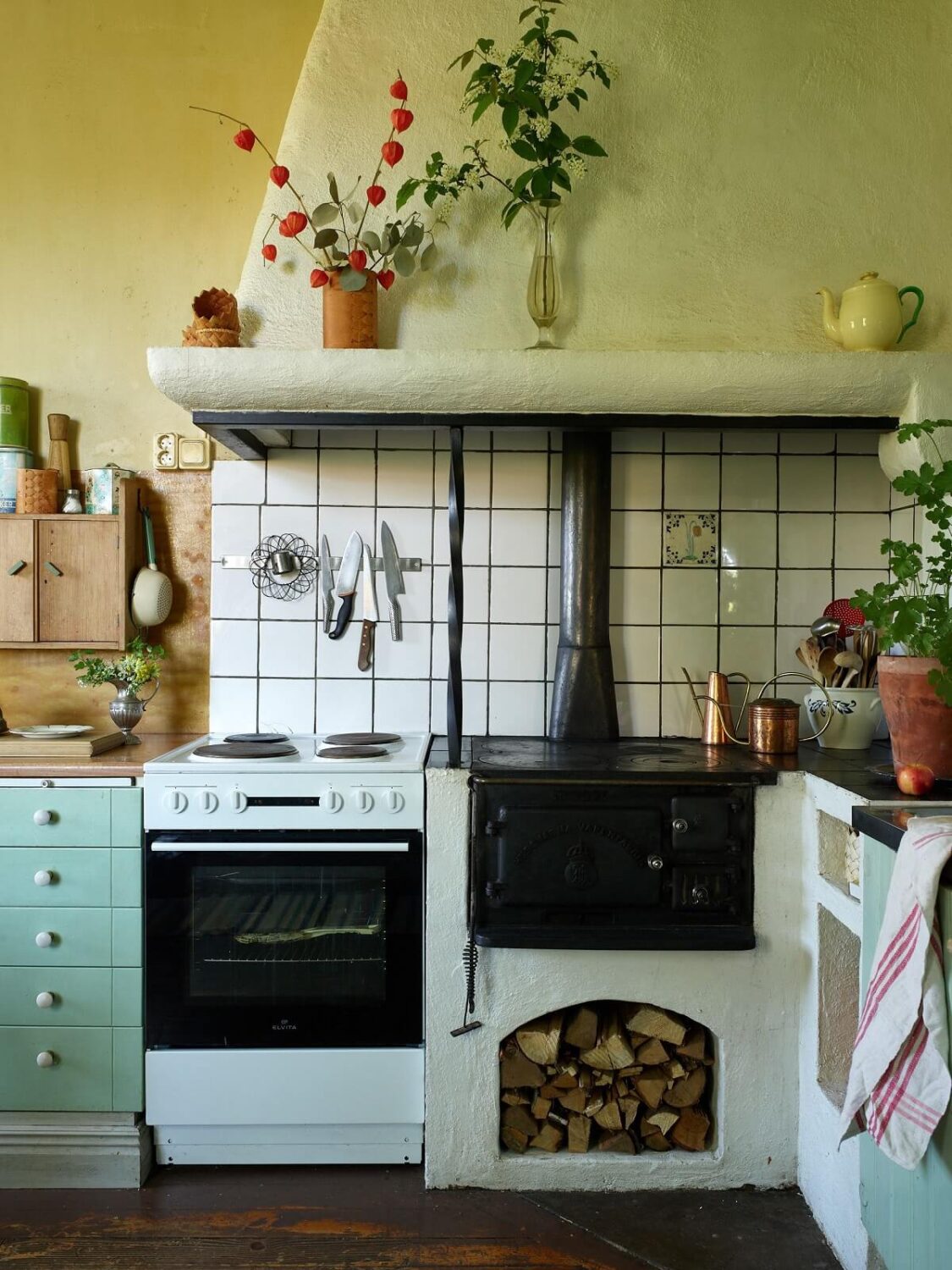 A Vintage Colorful Family Home in the Swedish Countryside 13 green-walls-kitchen-original-wood-burning-stove-nordroom