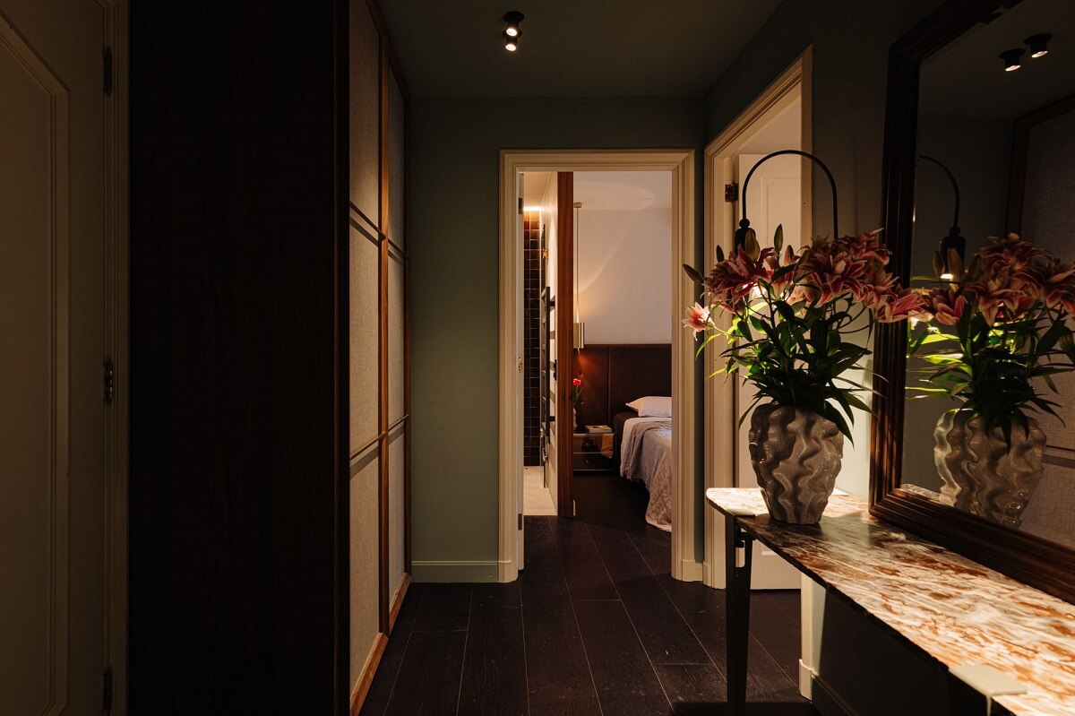 A Luxurious Duplex Apartment in Amsterdam 11 hallway-wardrobes-green-walls-dark-wooden-floor-nordroom