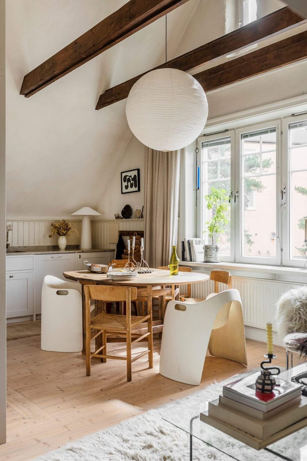 A Charming Attic Apartment with High Ceilings 1 high-ceiling-exposed-wooden-beams-kitchen-dining-table-nordroom