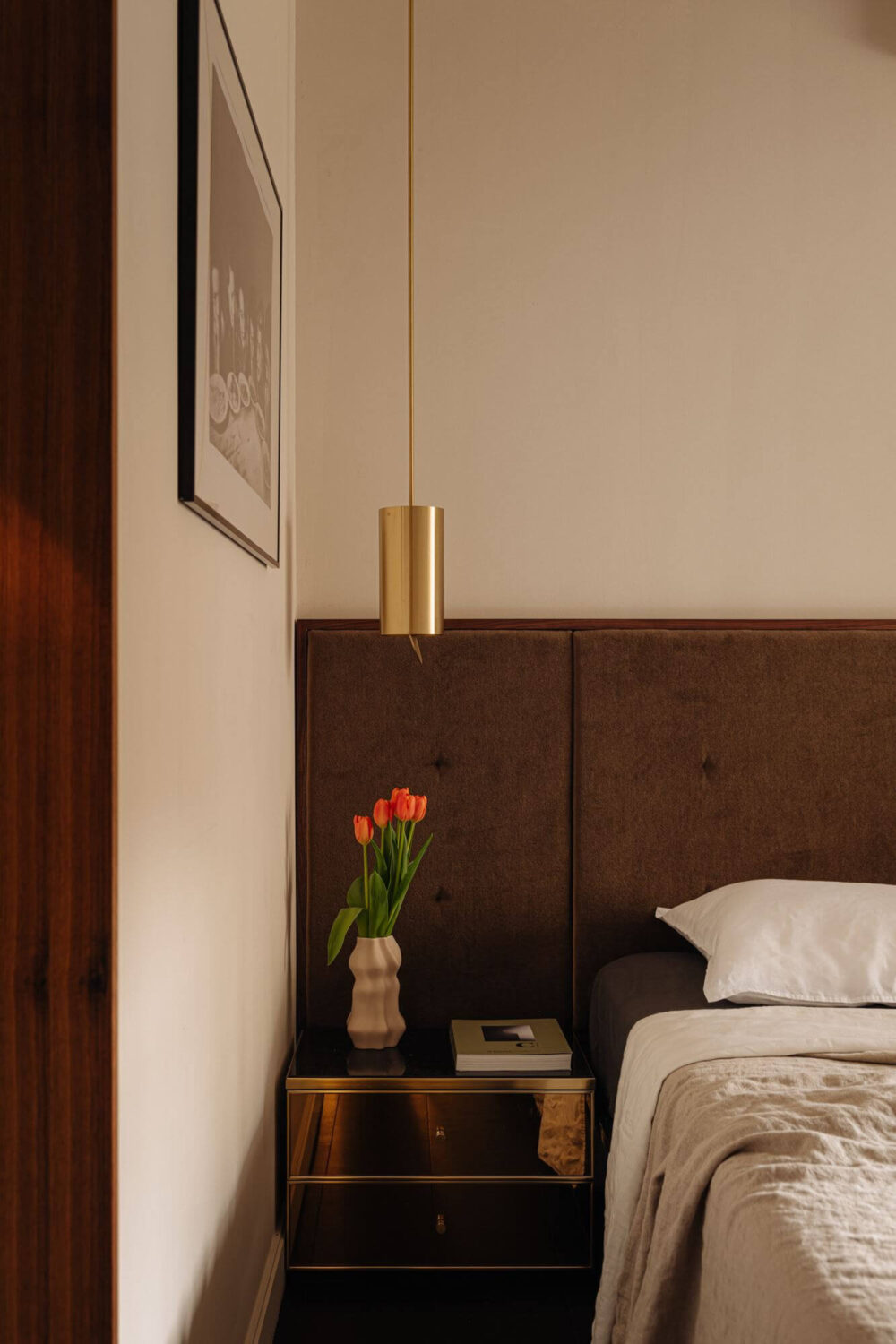 A Luxurious Duplex Apartment in Amsterdam 15 hotel-style-bedroom-textured-headboard-gold-nightstand-nordroom