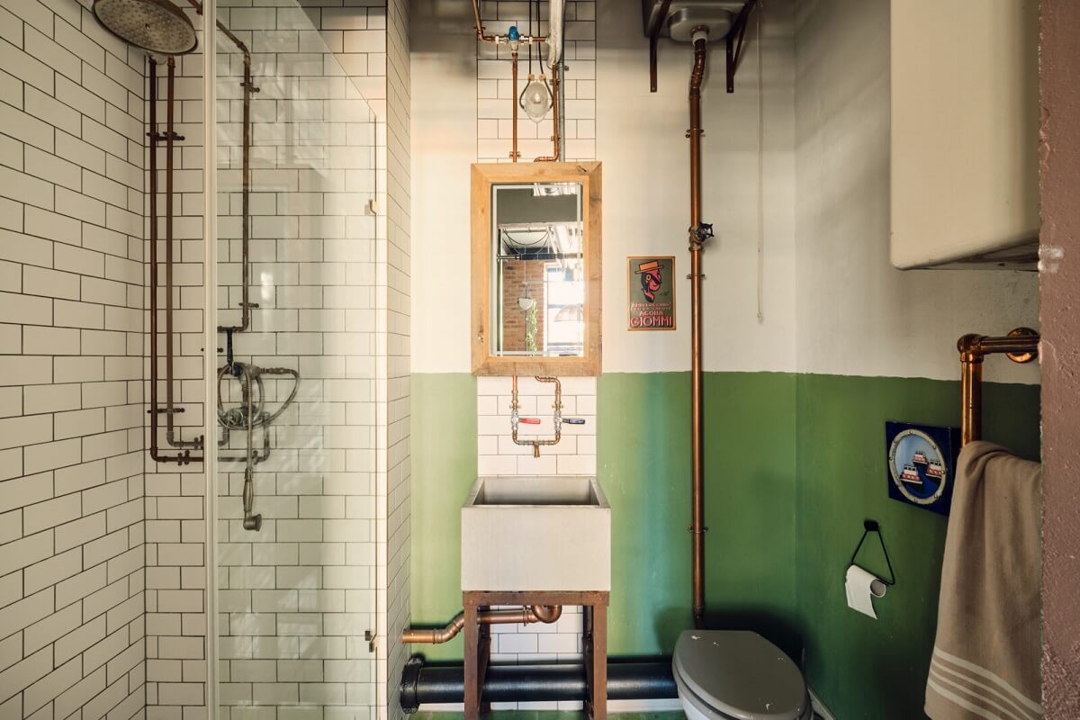 An Industrial Warehouse Apartment in London 15 industrial-bathroom-half-painted-green-wall-nordroom