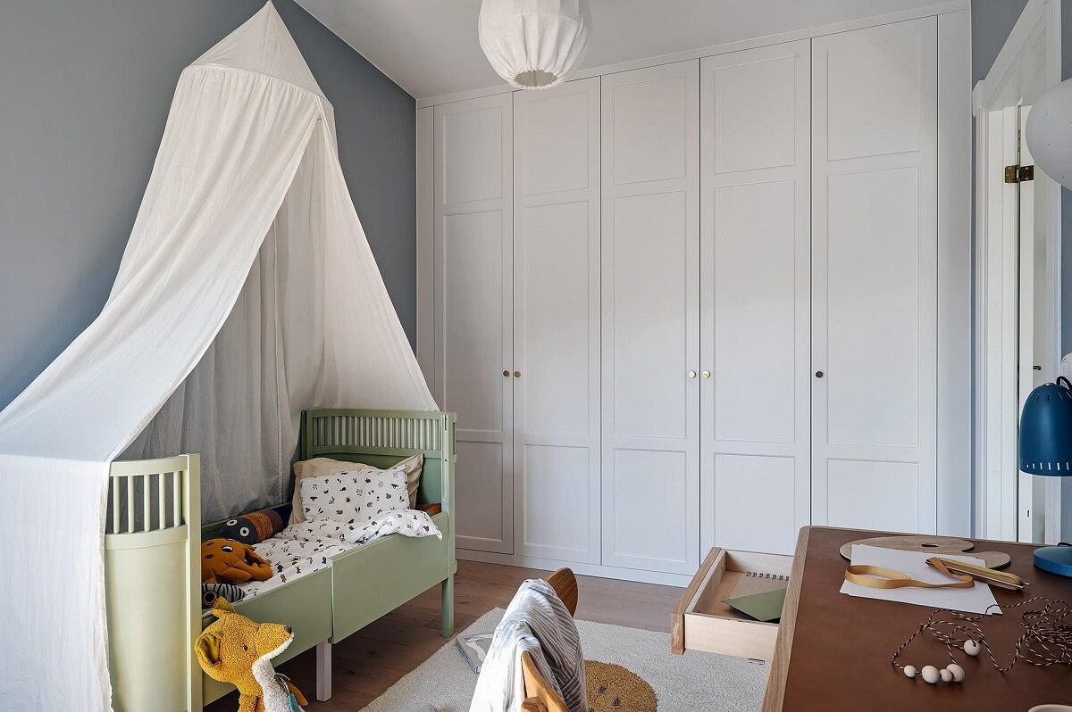 A Modern Scandinavian Attic Apartment 24 kids-bedroom-light-green-bed-built-in-wardrobes-nordroom