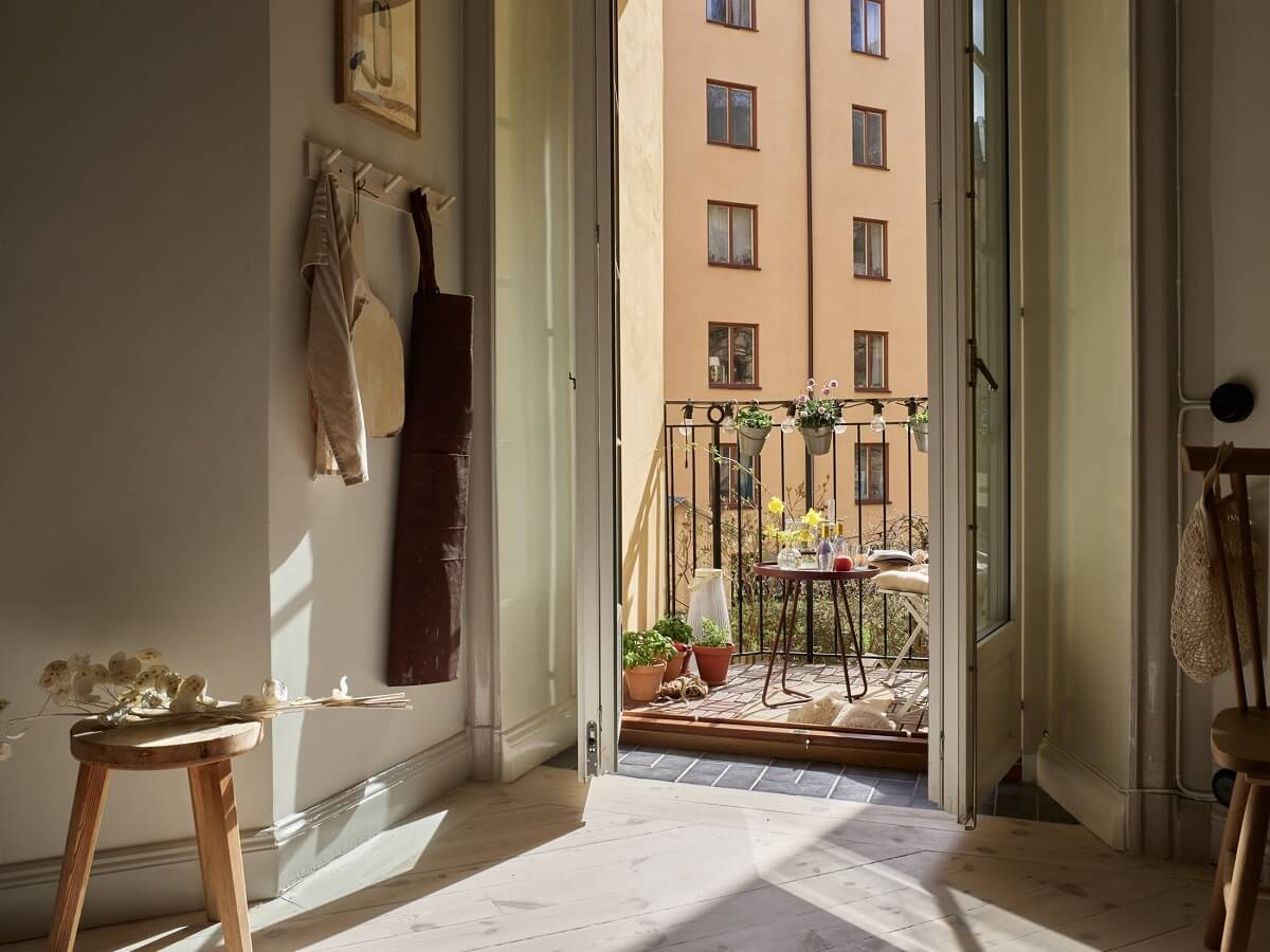 Warm Muted Colors in a Stockholm Apartment 8 kitchen-balcony-beige-apartment-nordroom