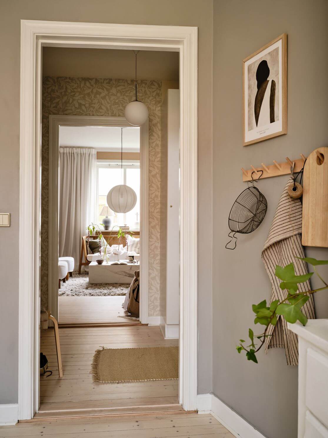 A Warm Beige Studio Apartment in Sweden 14 kitchen-light-gray-walls-view-to-studio-nordroom