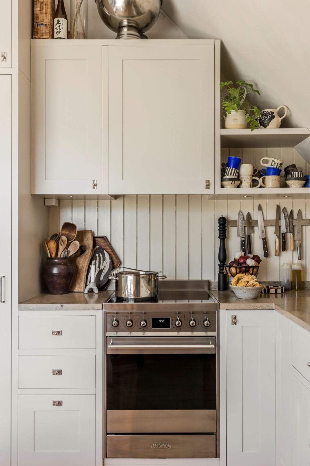 A Charming Attic Apartment with High Ceilings 5 kitchen-slanted-ceiling-open-shelves-nordroom