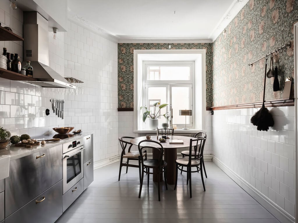 A Scandi Home with Stainless Steel Kitchen and Wallpaper 1 kitchen-stainless-steel-cabinets-white-tiles-round-dining-table-nordroom