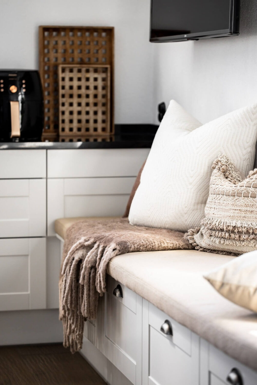 A Monochrome Swedish Villa with High Ceilings 13 kitchen-window-seat-underneath-storage-nordroom