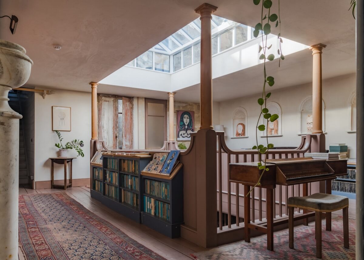 A Unique Historic House with Old Fashioned Shop in Bath 9 landing-bookcases-vintage-rugs-skylight-nordroom