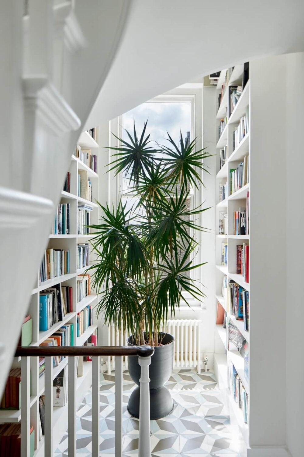 A Light Victorian Townhouse with Teal Reading Room 12 light-landing-bookcases-nordroom