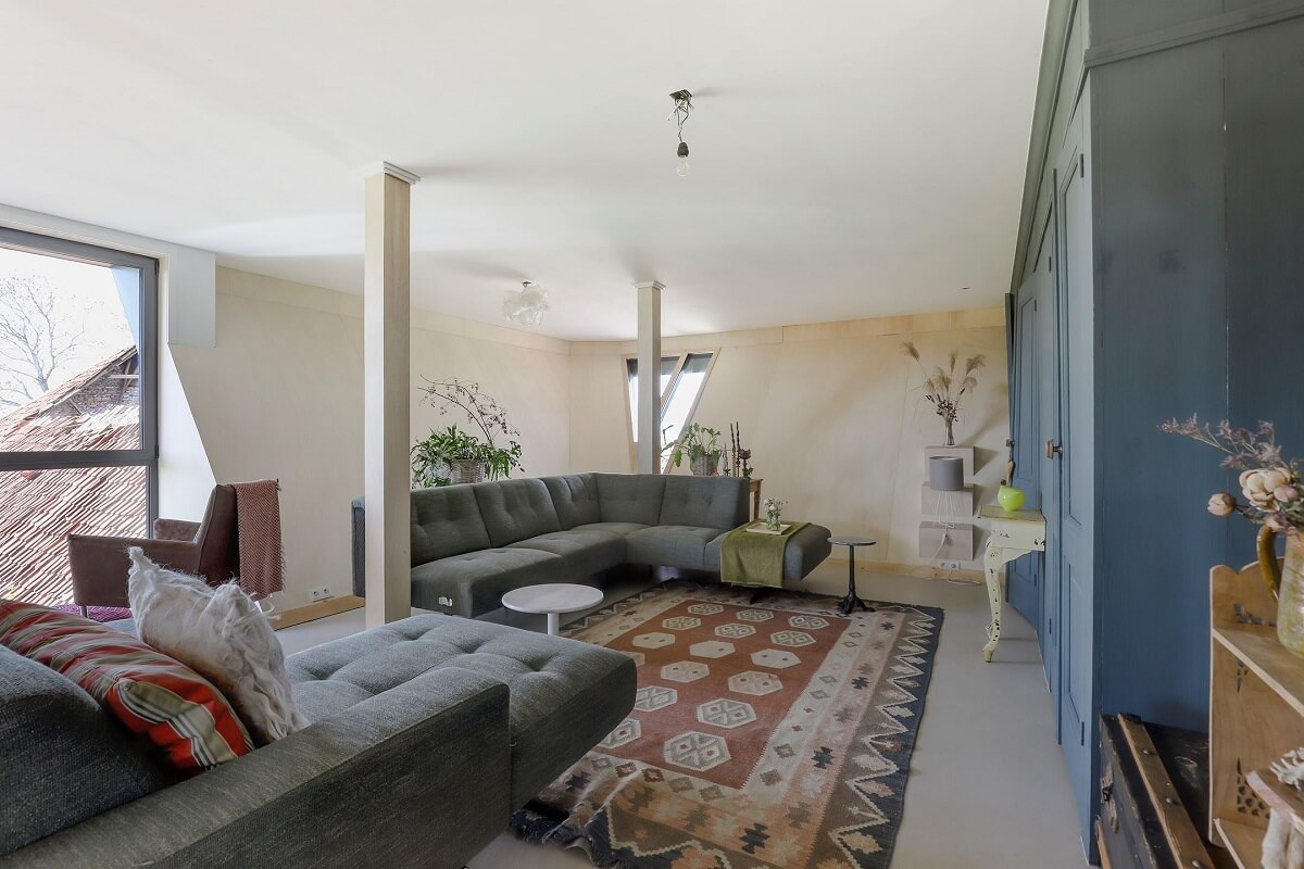 A Unique Upside Down House in The Netherlands 5 living-room-blue-cabinets-slanted-walls-nordroom