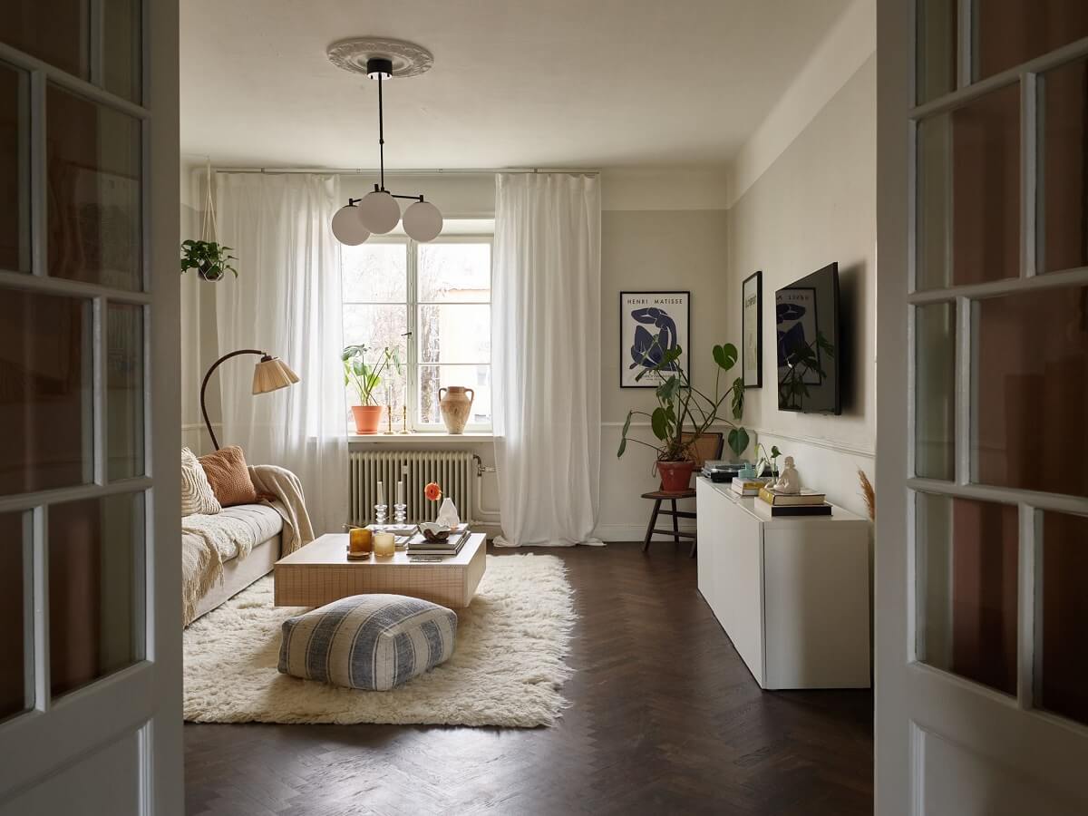 A Scandinavian Apartment with a Light Green Bedroom 6 living-room-dark-wooden-floor-herringbone-pattern-light-gray-walls-nordroom