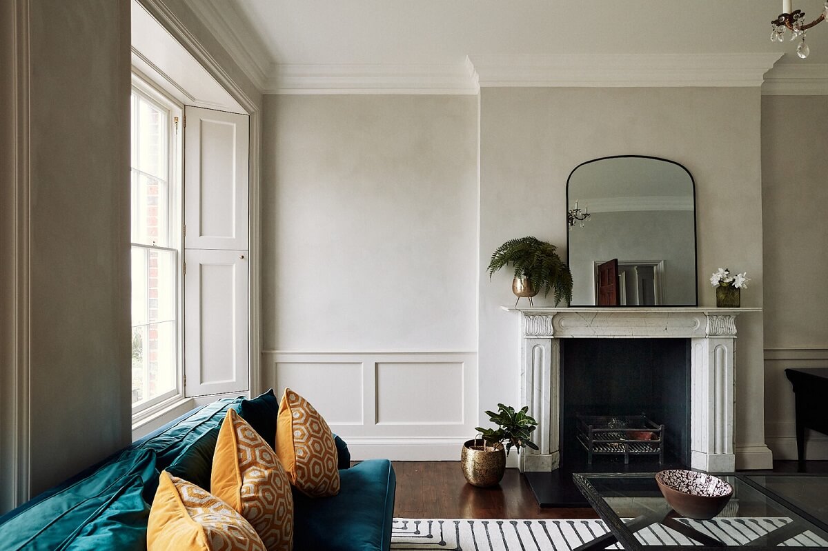 A Georgian Townhouse with Views of the Falmouth Harbour 10 living-room-fireplace-blue-sofa-yellow-pillows-nordroom