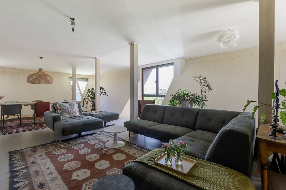 A Unique Upside Down House in The Netherlands 7 living-room-large-rug-slanted-walls-nordroom