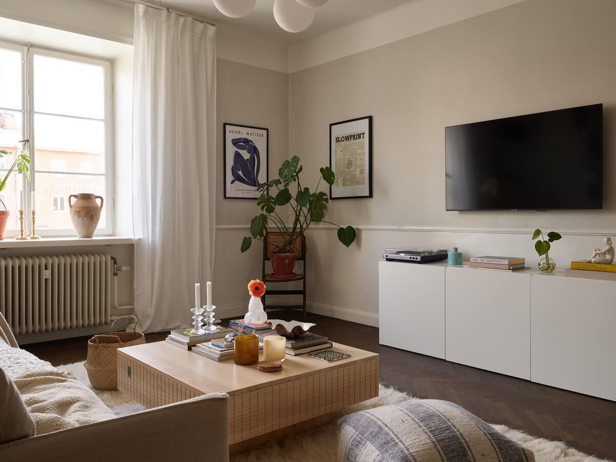 A Scandinavian Apartment with a Light Green Bedroom 3 living-room-light-gray-walls-dark-herringbone-floor-nordroom