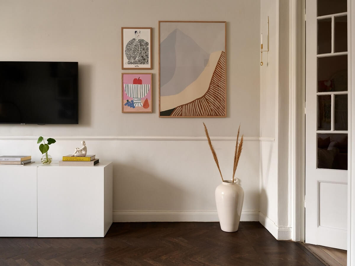 A Scandinavian Apartment with a Light Green Bedroom 5 living-room-light-gray-walls-dark-herringbone-floor-white-cabinets-nordroom