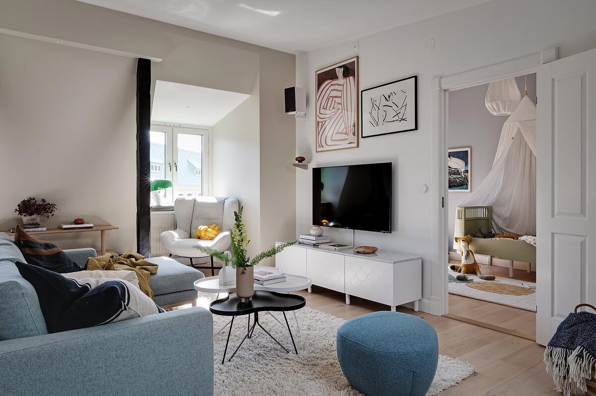 A Modern Scandinavian Attic Apartment 11 living-room-scandinavian-design-blue-sofa-nordroom