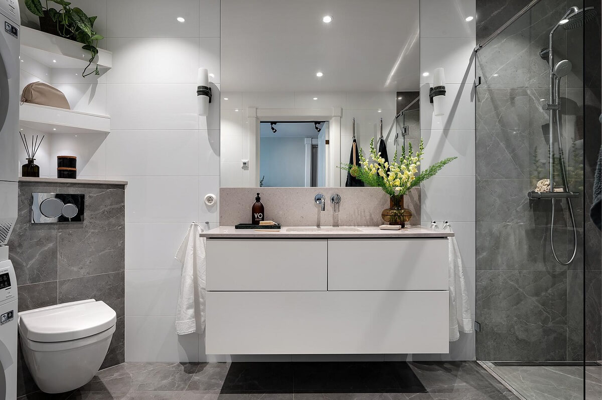 A Modern Scandinavian Attic Apartment 29 luxury-bathroom-gray-tiles-white-vanity-nordroom