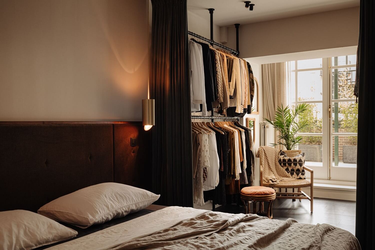 A Luxurious Duplex Apartment in Amsterdam 12 master-bedroom-open-wardrobe-garden-acces-room-divider-curtain-nordroom