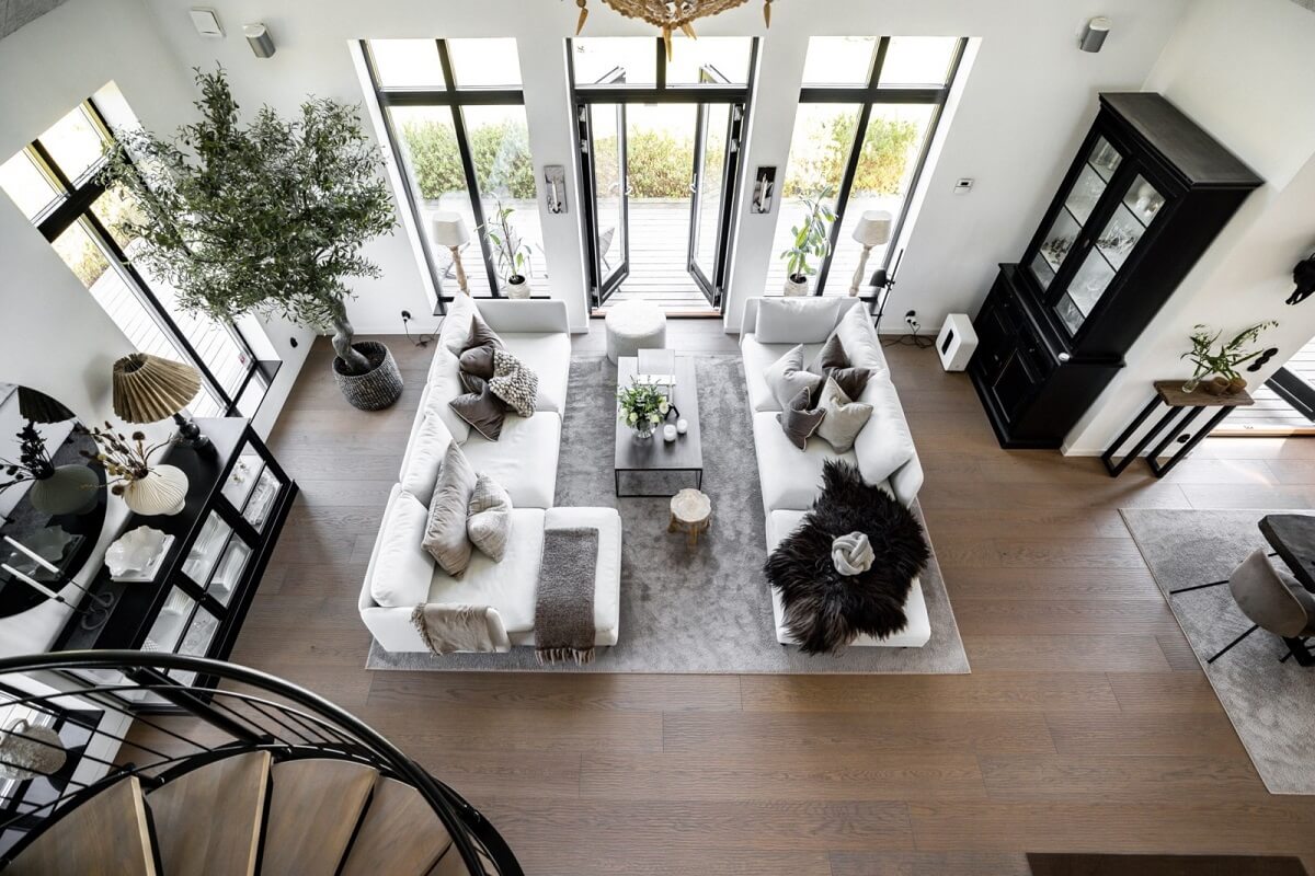A Monochrome Swedish Villa with High Ceilings 5 monochrome-living-space-white-sofas-wooden-floor-nordroom
