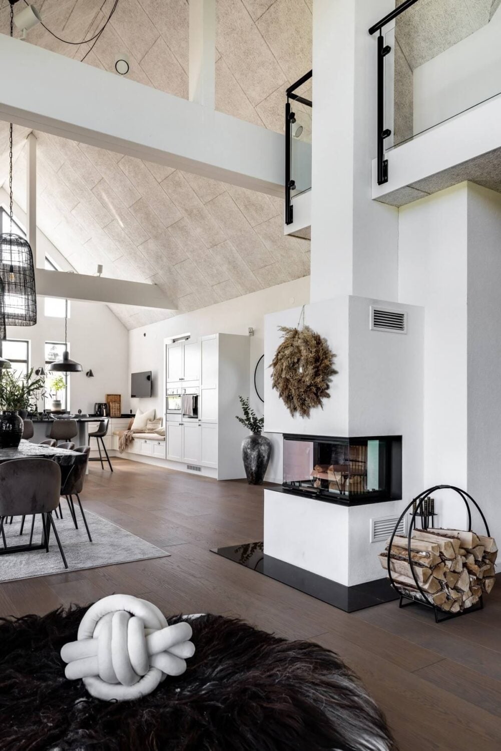 A Monochrome Swedish Villa with High Ceilings 7 monochrome-scandinavian-villa-fireplace-vaulted-ceiling-nordroom