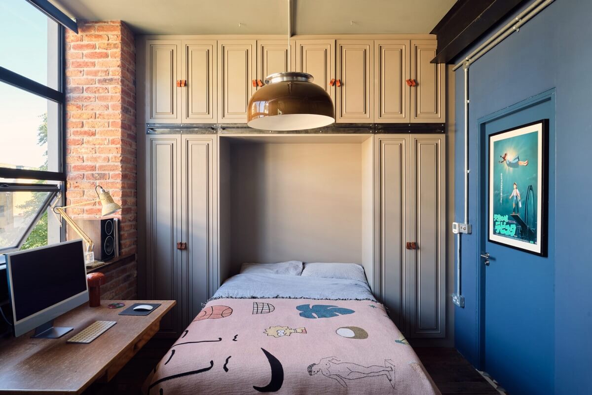 An Industrial Warehouse Apartment in London 10 murphy-bed-guest-bedroom-built-in-wardrobes-blue-accent-wall-nordroom