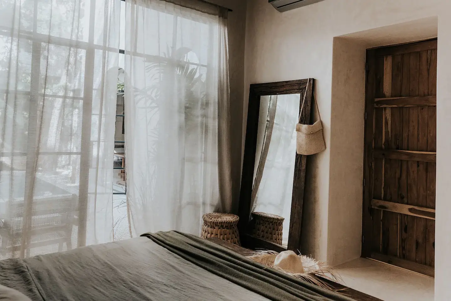 Rustic Wooden Elements in a Stylish Tulum Airbnb 21 natural-bedroom-large-wooden-mirror-rustic-wooden-door-nordroom