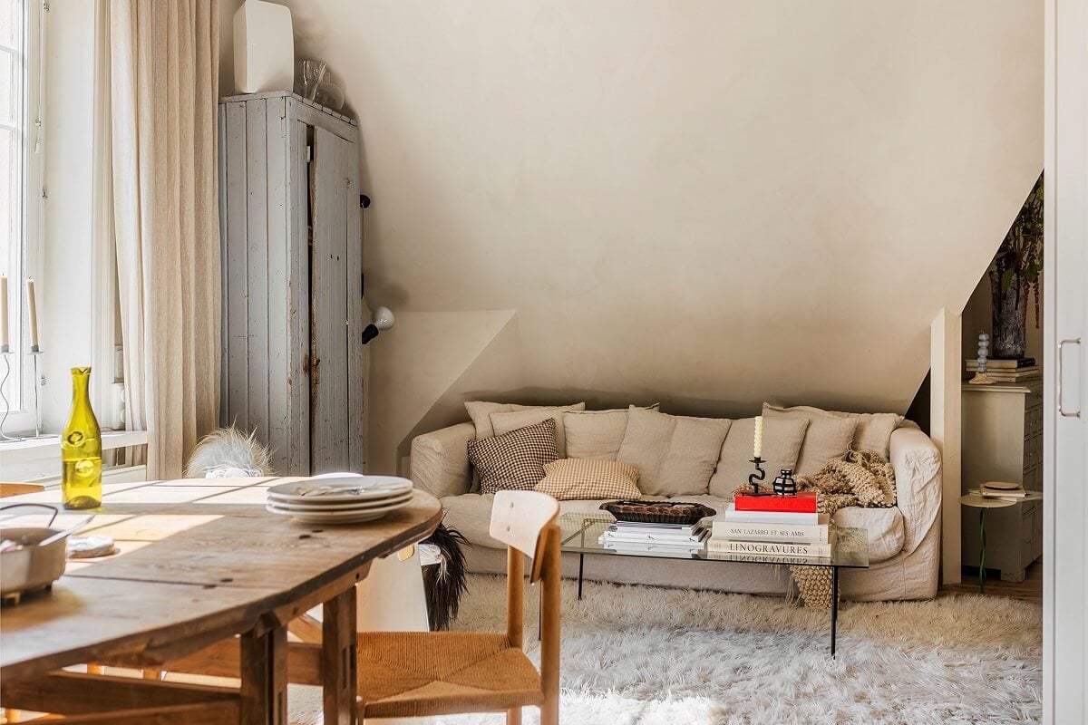 A Charming Attic Apartment with High Ceilings 8 open-plan-living-kitchen-slanted-ceiling-light-colors-nordroom