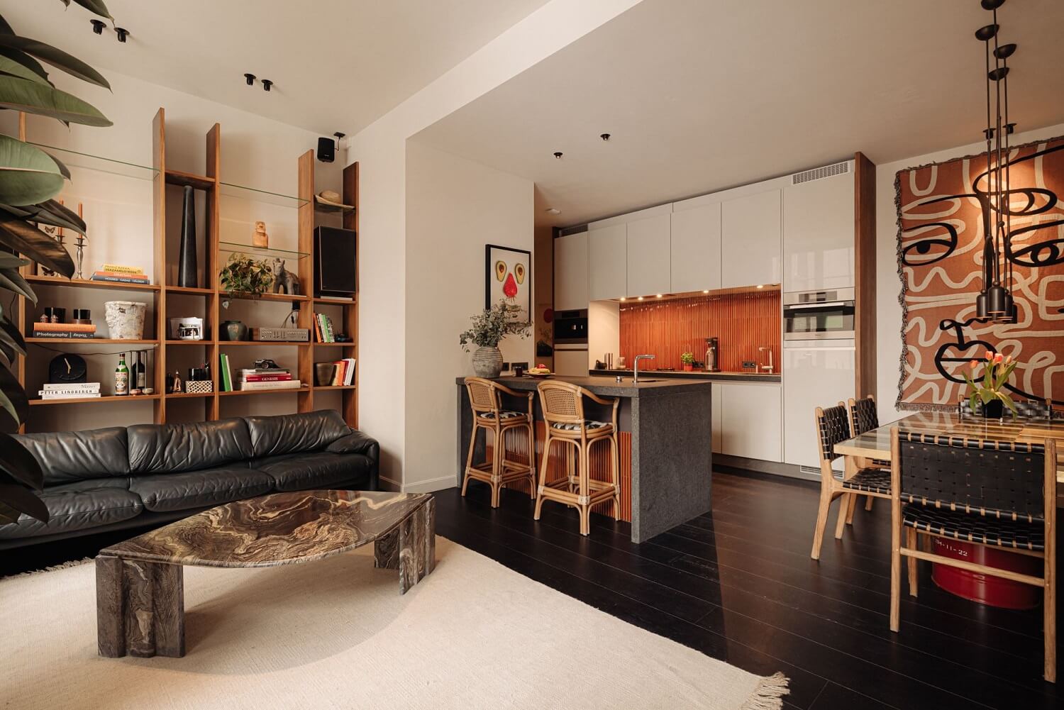 open-plan-living-space-kichen-custom-bookcase-dark-wooden-floor-nordroom
