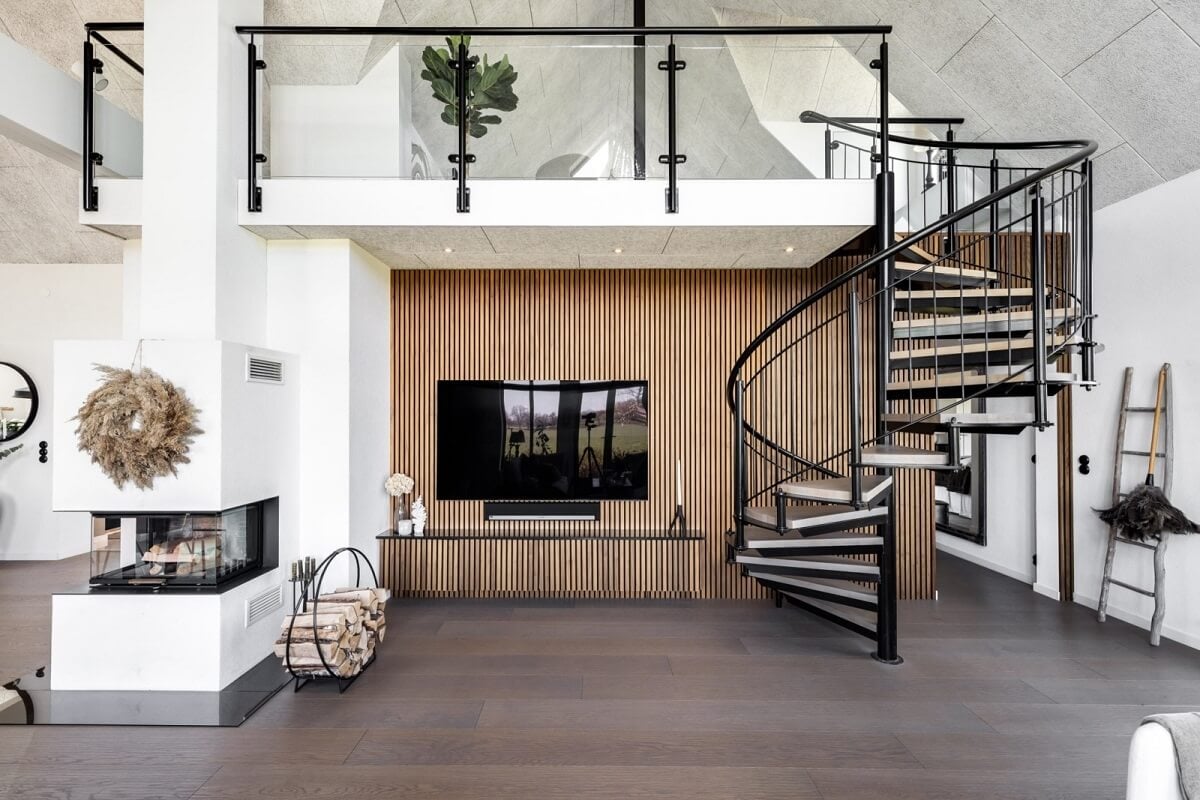 A Monochrome Swedish Villa with High Ceilings 17 open-plan-living-space-spiral-staircase-wooden-accent-wall-nordroom