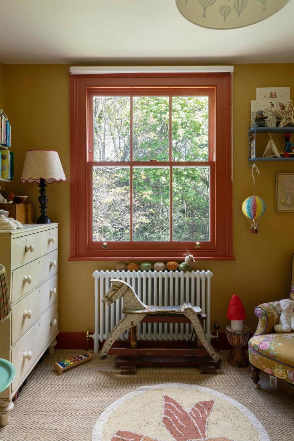 Beautiful Gender Neutral Nursery Ideas 25 orange-red-window-frame-ochre-yellow-walls-nursery-nordroom