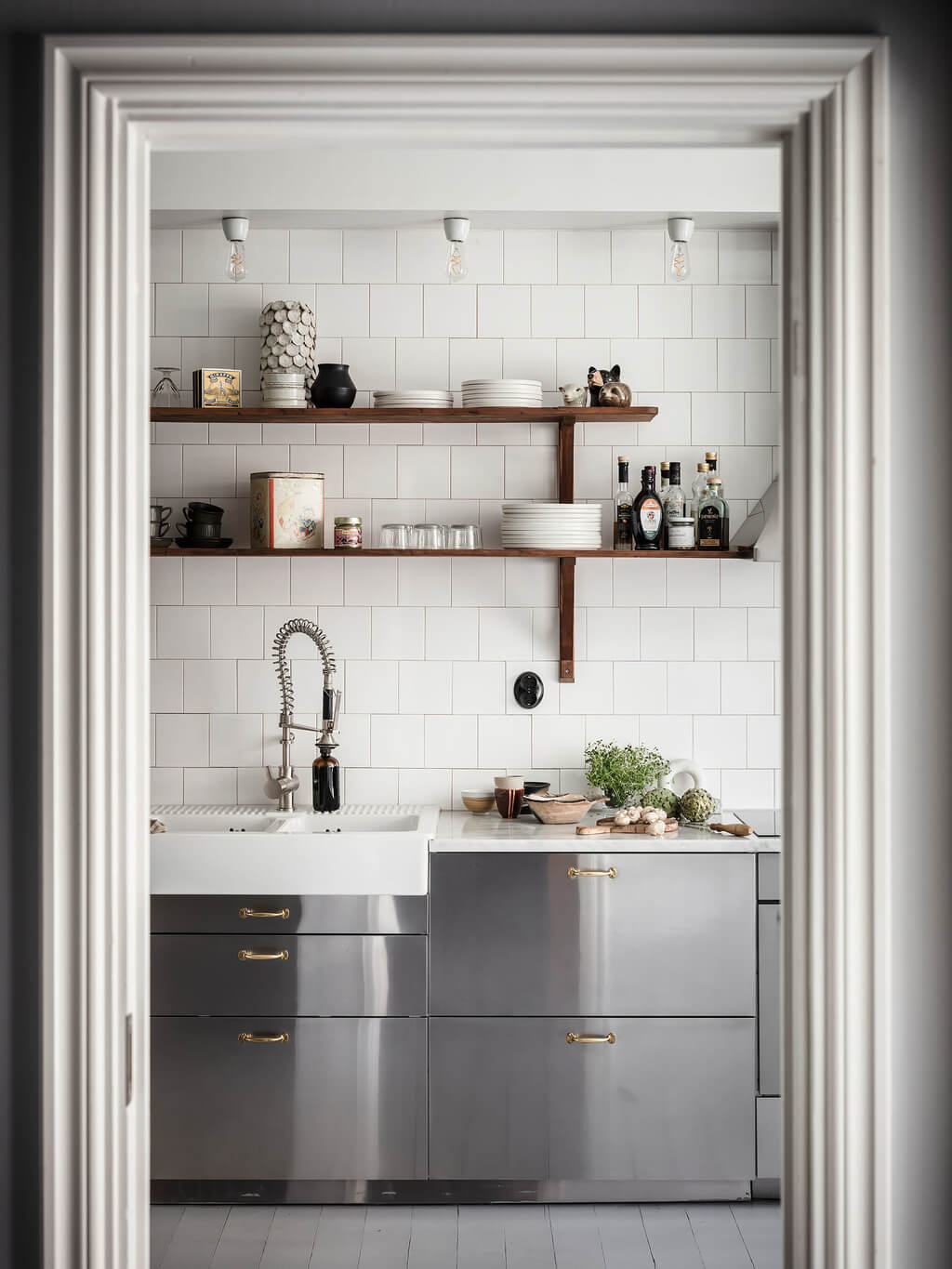 A Scandi Home with Stainless Steel Kitchen and Wallpaper 9 peek-to-kitchen-stainless-steel-cabinets-wooden-shelves-nordroom