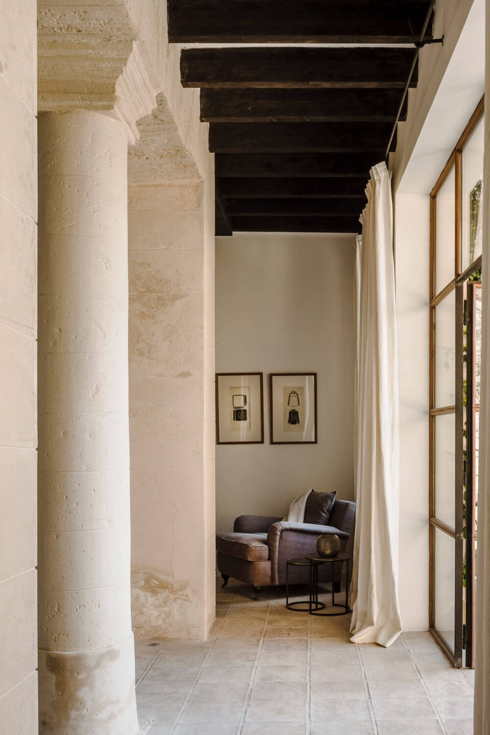 A Renovated Historic Townhouse on Mallorca 8 reading-nook-leather-sofa-wooden-ceiling-beams-nordroom