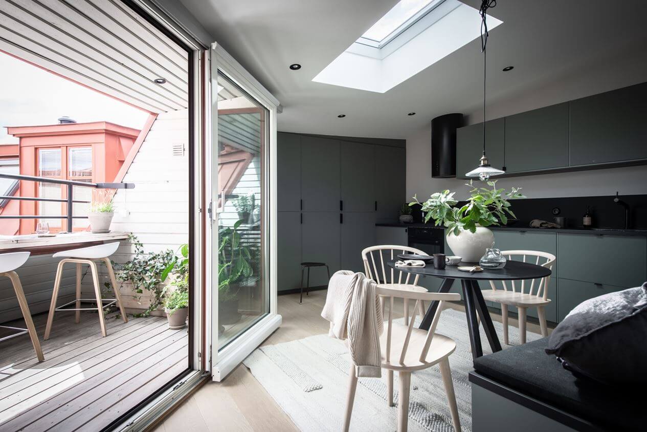 A Stylish Scandinavian Attic Apartment 6 scandinavian-kitchen-green-cabinets-skylight-balcony-nordorom