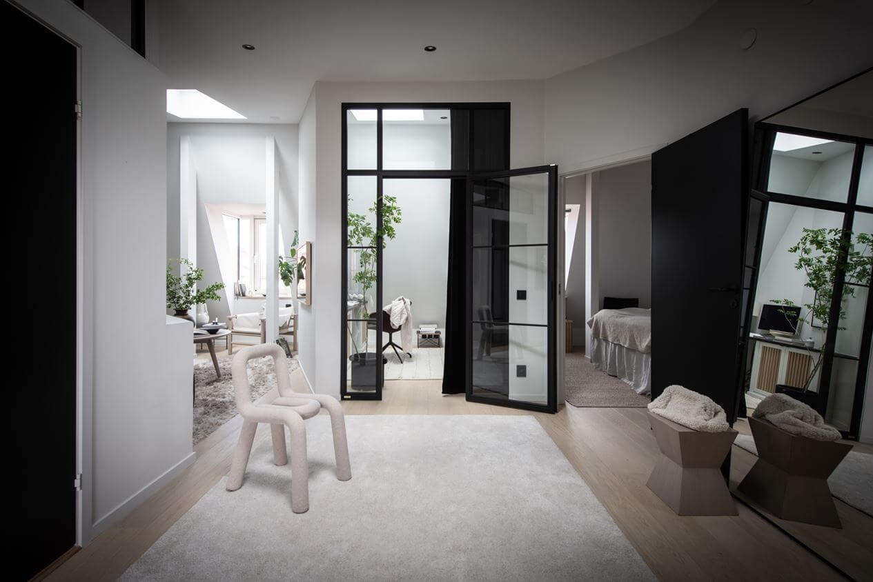 A Stylish Scandinavian Attic Apartment 15 scandinavian-style-attic-apartment-hallway-large-white-rug-mirror-nordroom