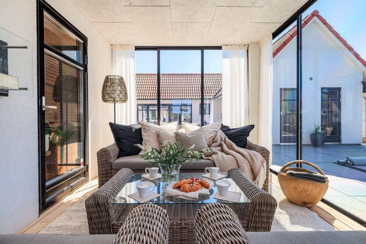 A Monochrome Swedish Villa with High Ceilings 27 seating-sun-room-scandinavian-home-nordrom