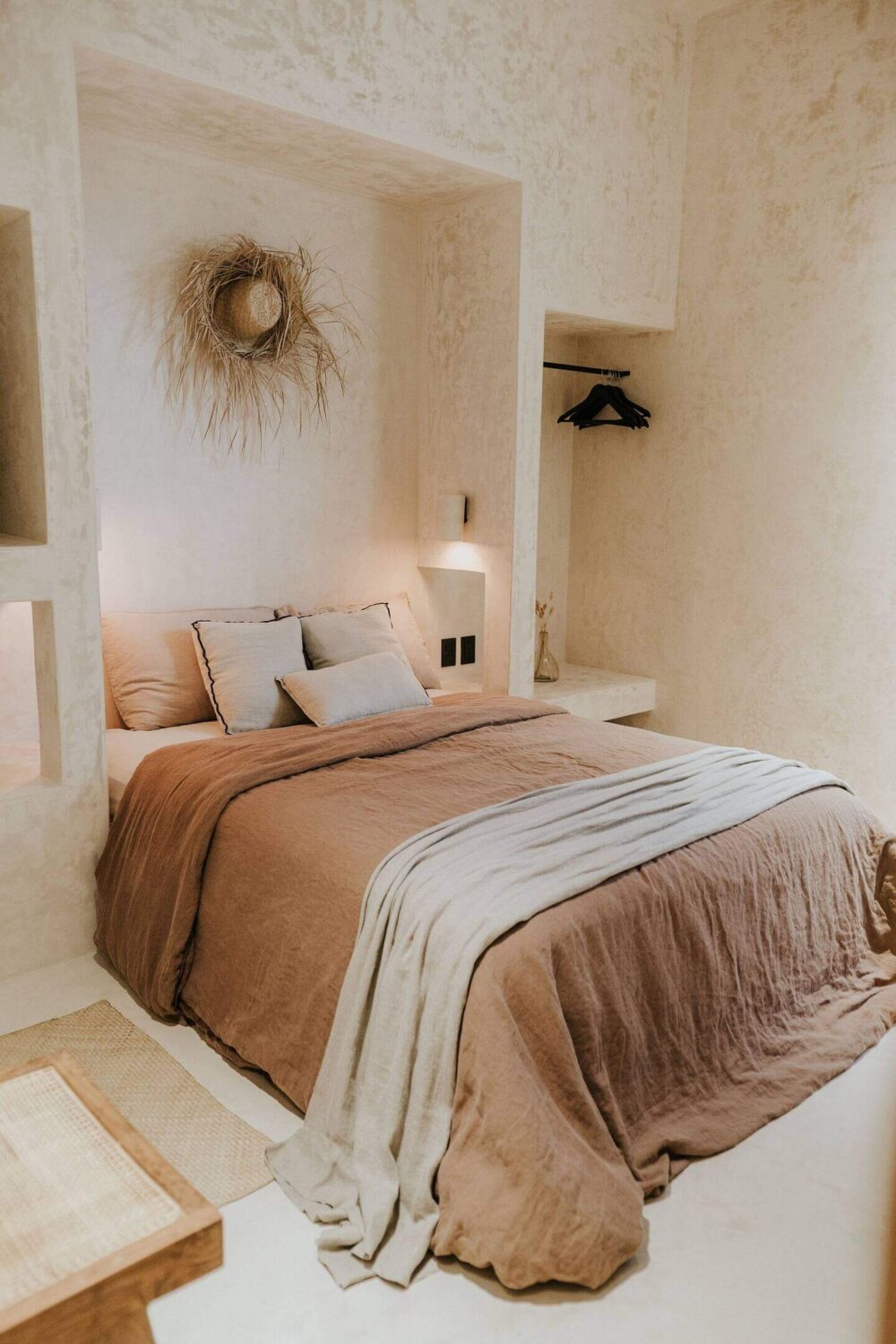 Rustic Wooden Elements in a Stylish Tulum Airbnb 24 serene-bedroom-earthy-colored-bedding-niche-for-bed-clothing-rack-nordroom